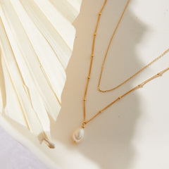 Layered Gold Chain Necklace with Baroque Pearl Pendant